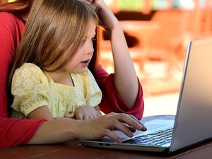 Little girl viewing Laptop Screen
