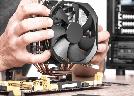 technician fixing computer fan