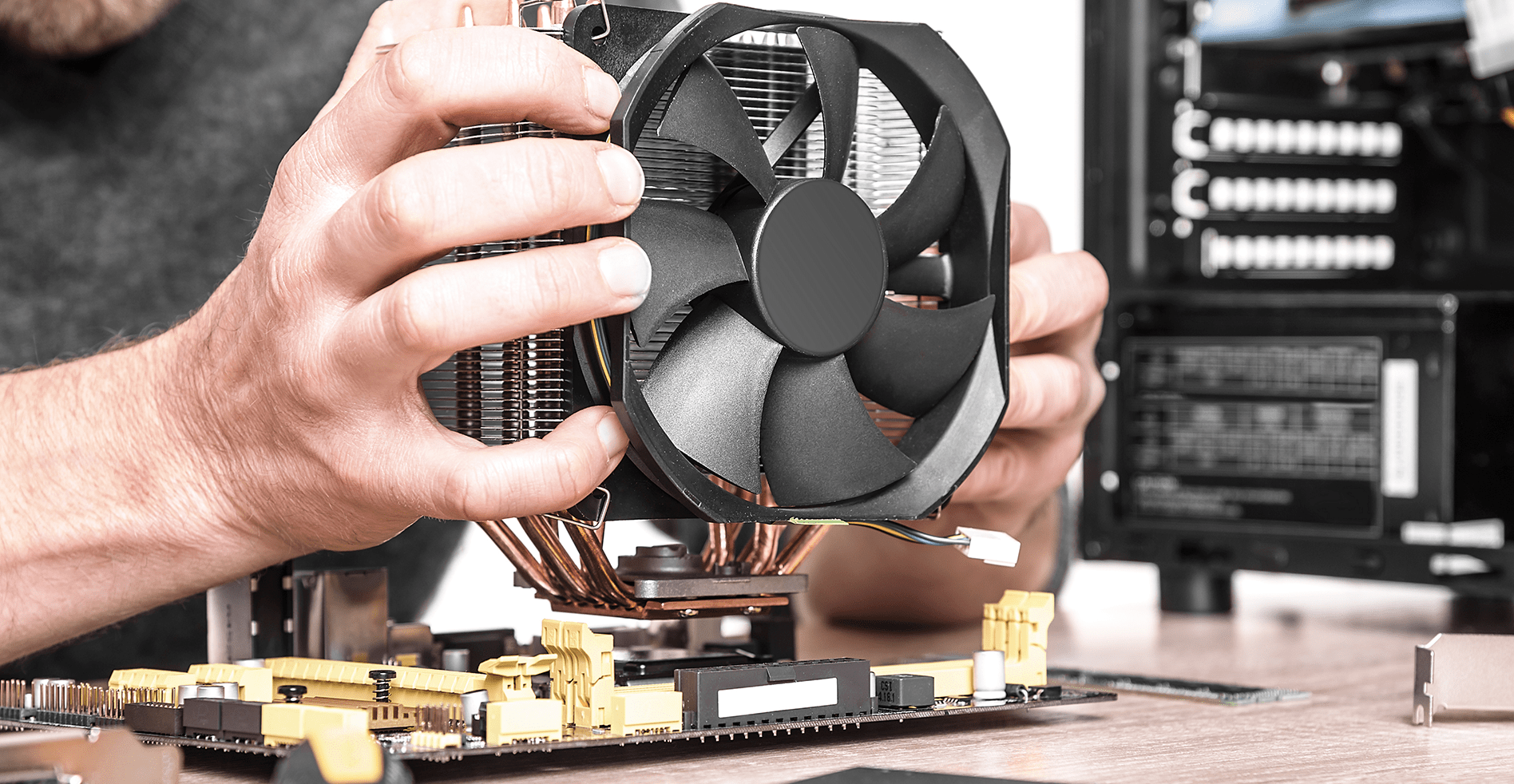 technician fixing computer fan