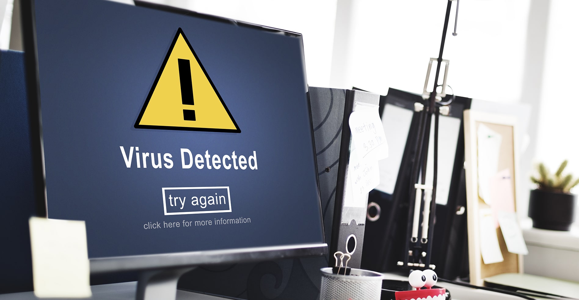 computer screen with virus warning
