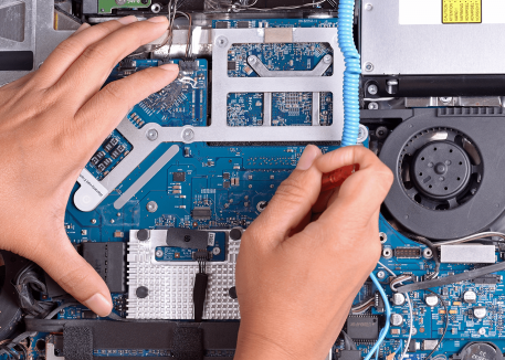 technician repairing macbook motherboard