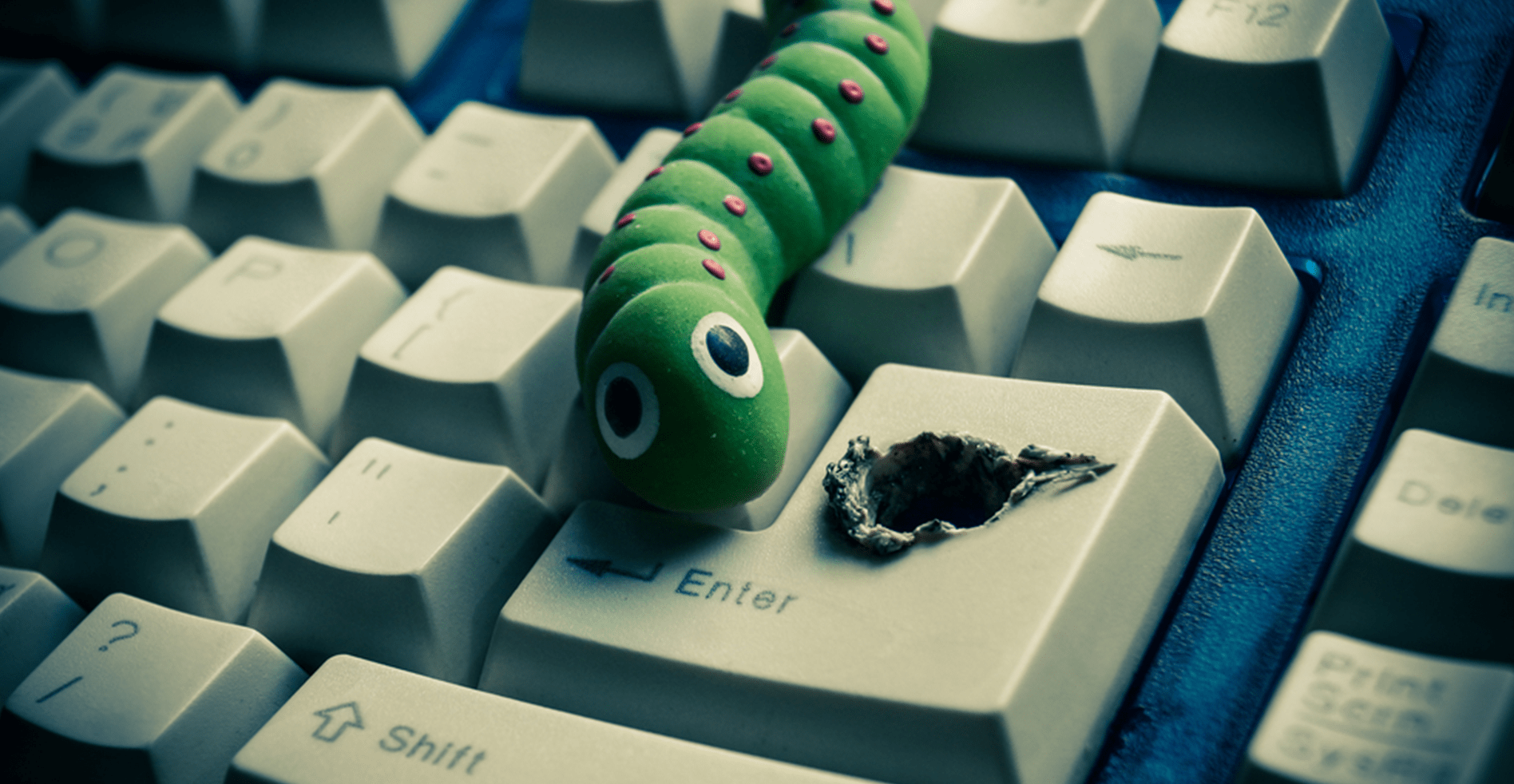 virus crawling out of keyboard