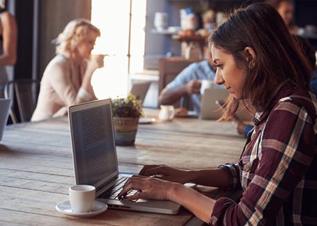 woman using laptop on wifi