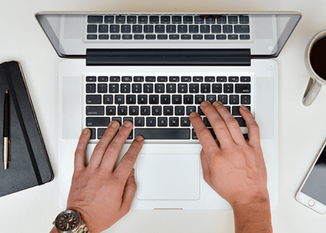 man using mac laptop