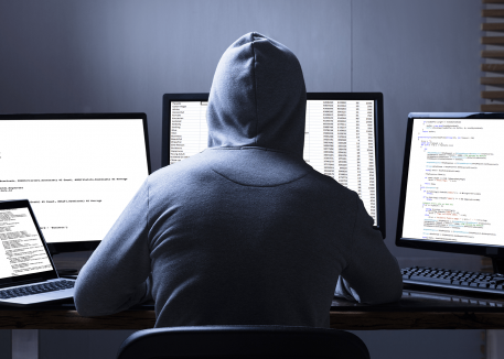 hacker on desktops and laptop