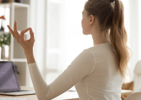 woman using laptop to de-stress