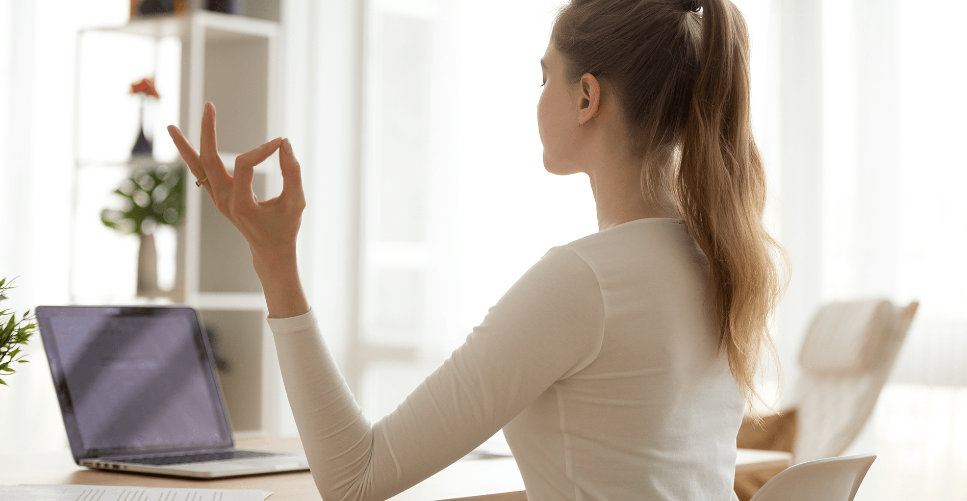 woman using laptop to de-stress