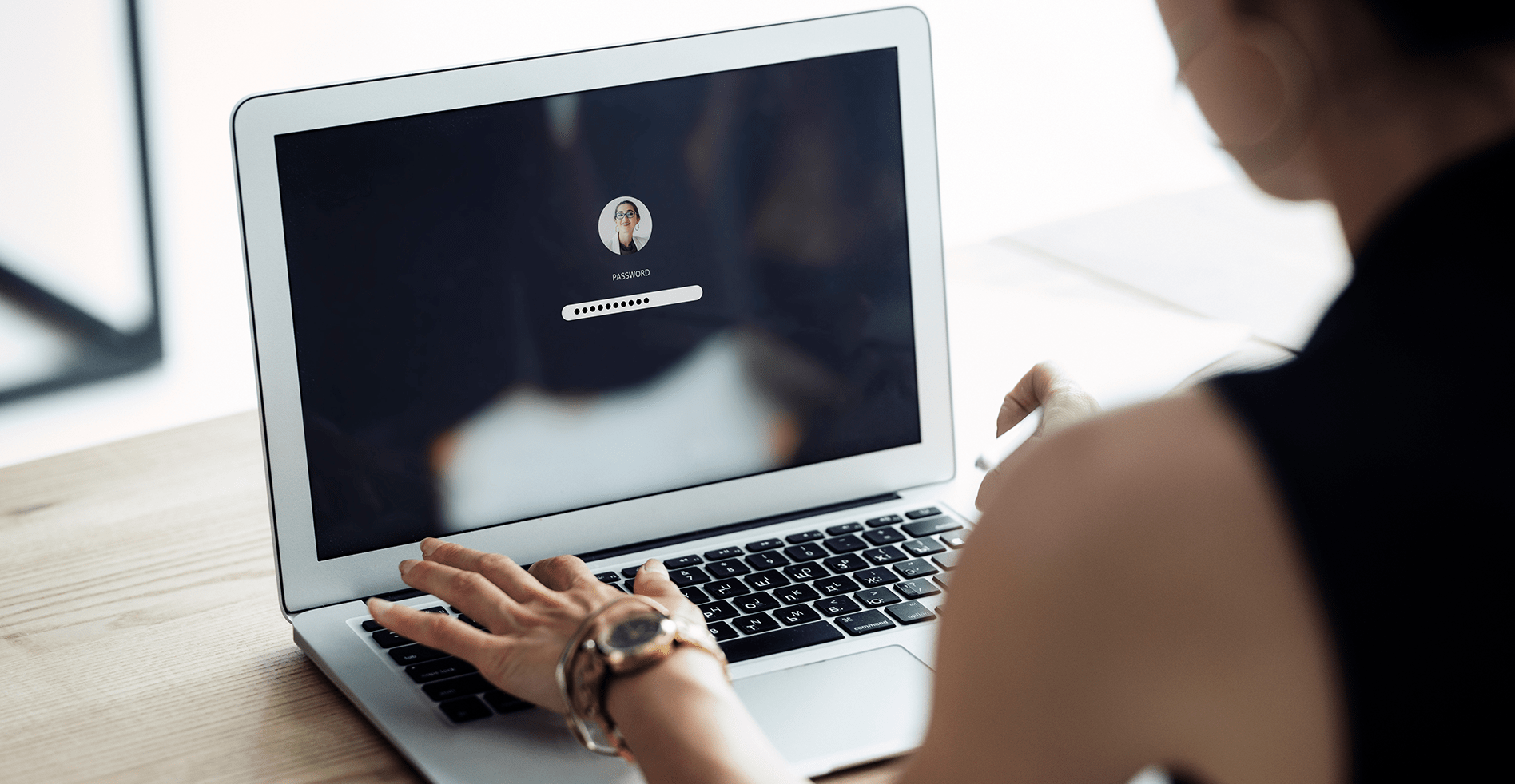 woman using password best practices on laptop