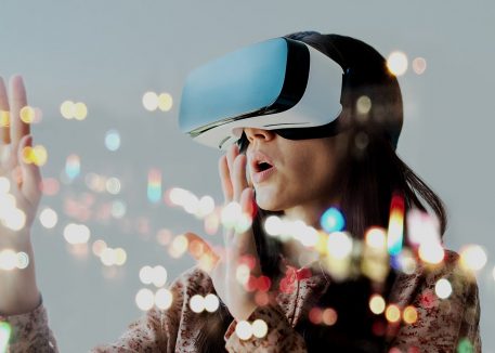 woman uses futuristic augmented reality headset