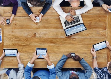 overhead view of small business using it support for their technology