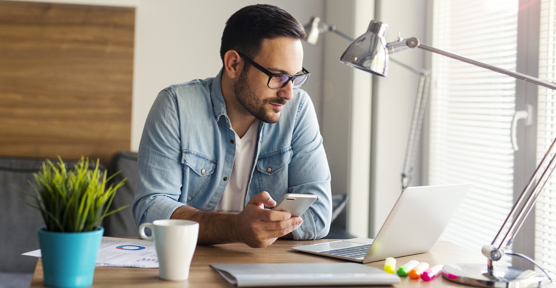 man works remotely in a home office