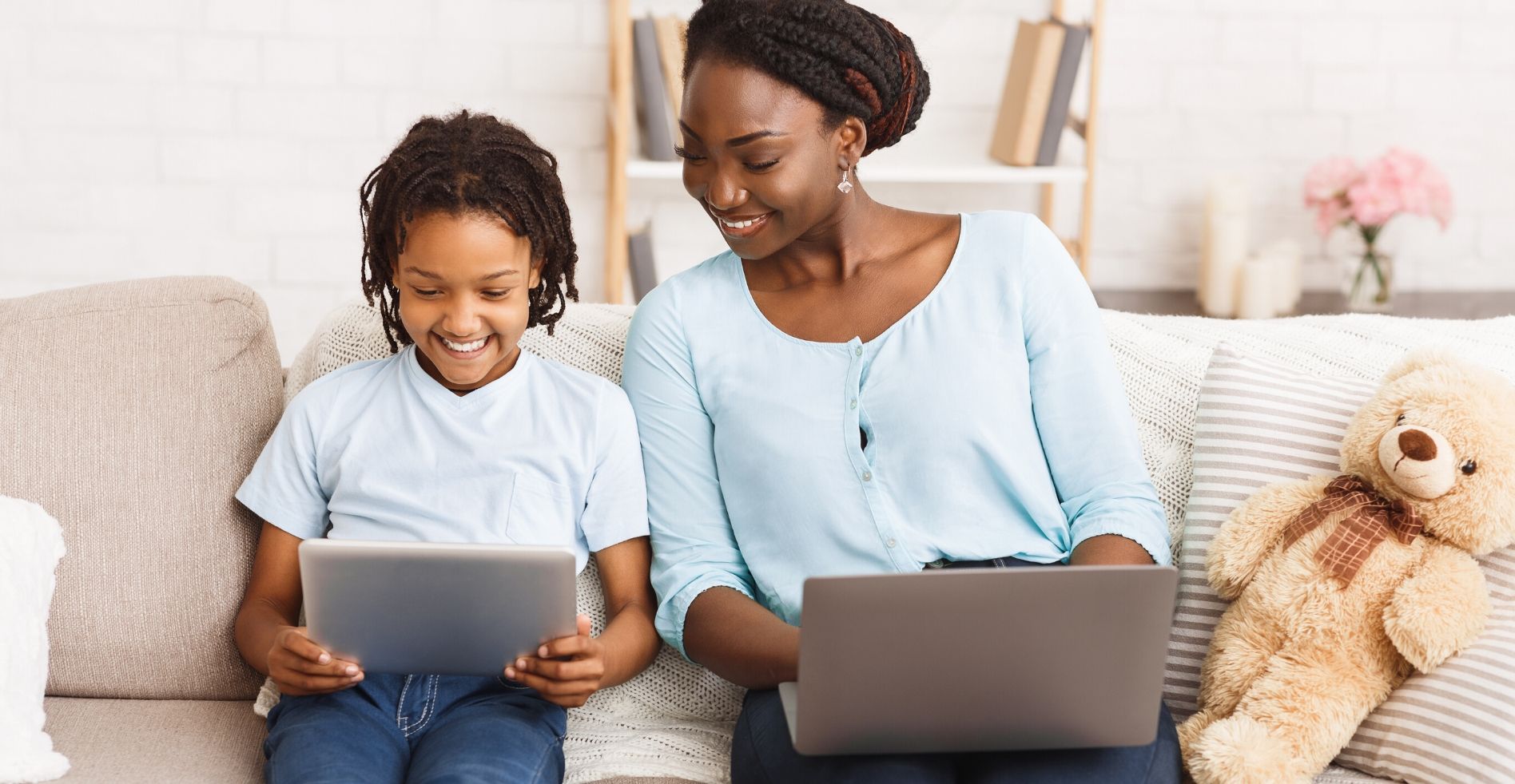 mom goes over school work with son on his tablet