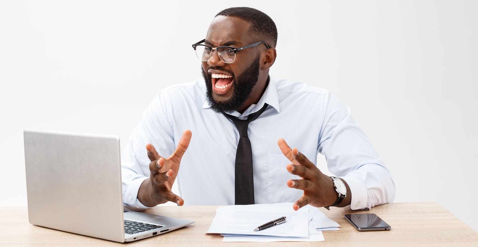 frustrated man using his laptop