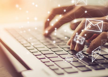 closeup of woman writing email in gmail