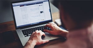 man with open browser on laptop